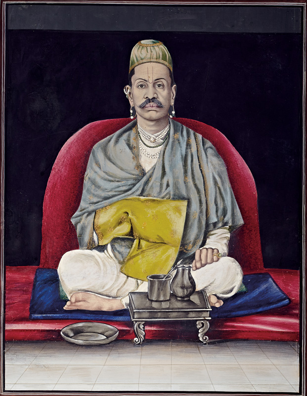 Govardhanlalji sitting in prayer, holding a Rosary Bag