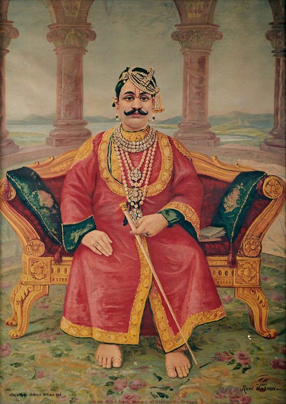 Tilkayat Govardhanlalji sitting on a red velvet sofa like a Maharaja